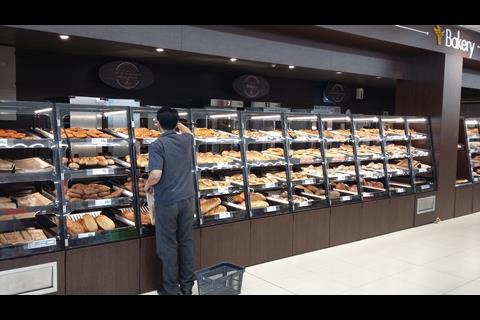 The bakery display has swapped wicker baskets for black metal and Perspex